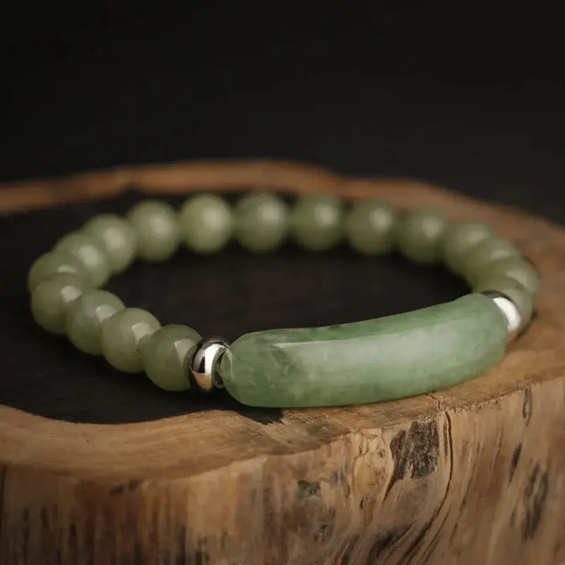 Bracelet en Aventurine Bande Courbe et Perles sur du bois brut kaosix