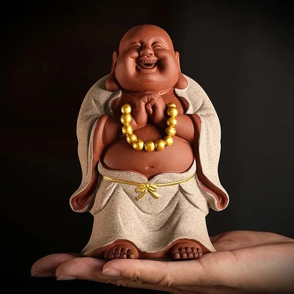 Petit Bouddha rieur blanc sur main kaosix