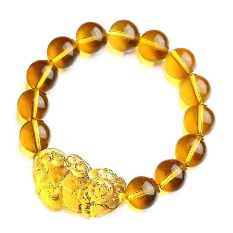 Bracelet Pi Xiu en citrine sur un sol blanc et vue de dessus Kaosix
