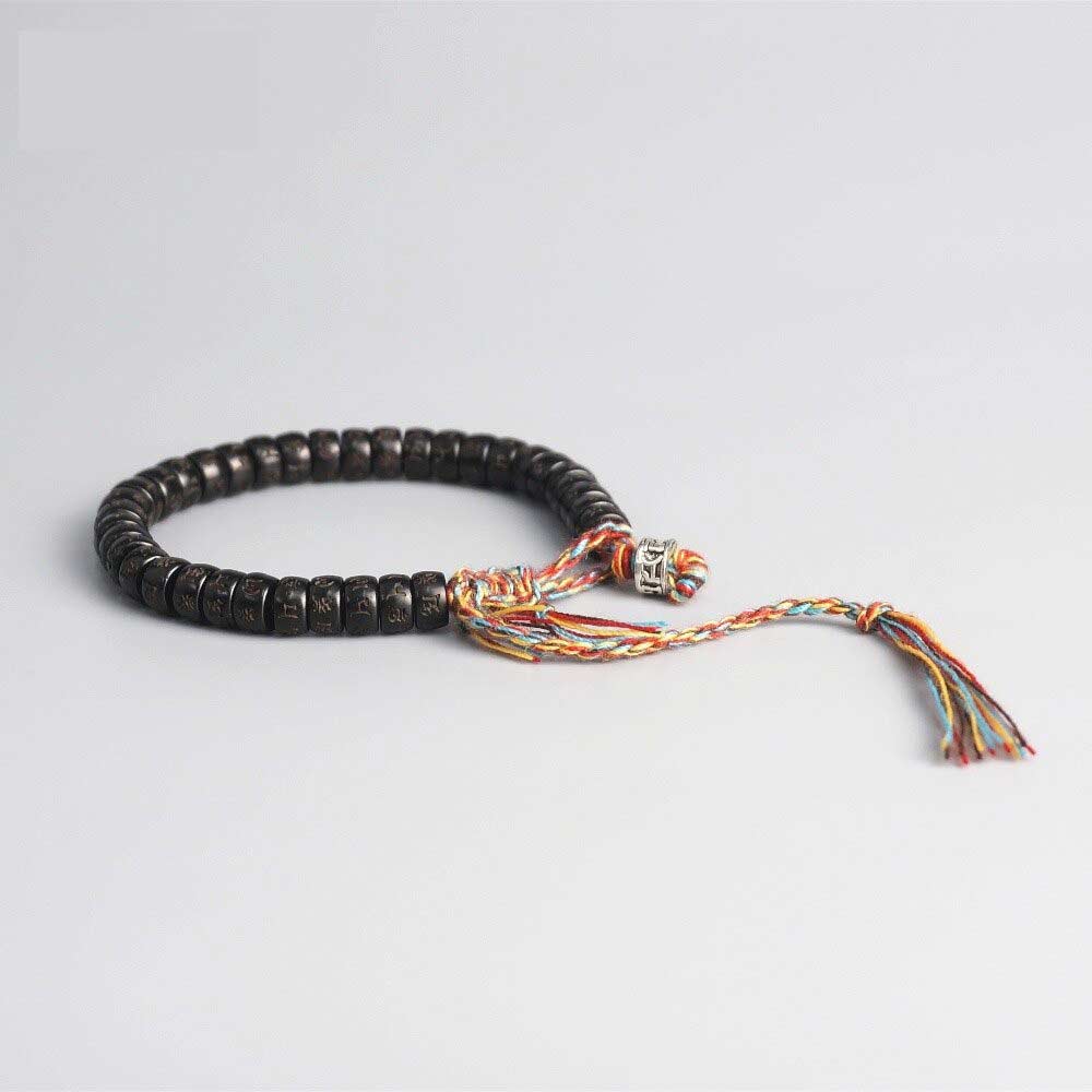 Bracelet tibétain coquille de coco mantra sur fond gris Kaosix