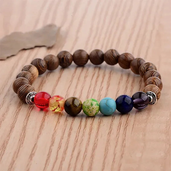 Bracelet 7 chakras méditation perles de bois sur plancher Kaosix