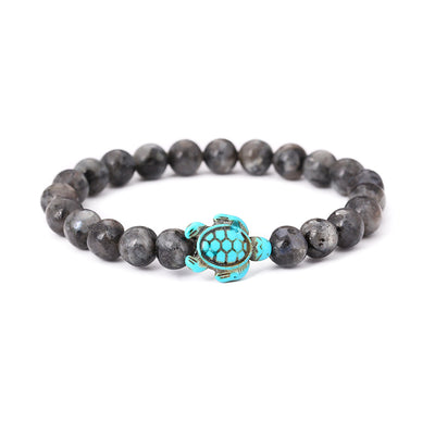 Bracelet Labradorite Grise Tortue Marine sur un sol blanc Kaosix