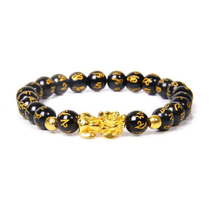 Bracelet Pi Xiu en obsidienne noire Mani Mantra sur fond blanc avec cadre orange kaosix