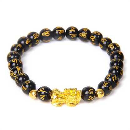 Bracelet Pi Xiu en obsidienne noire Mani Mantra sur fond blanc vue de dessus kaosix