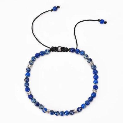 Bracelet Tibétain Jaspe Bleu sur un sol blanc vue de dessus kaosix