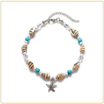 Bracelet de cheville en coquillages avec amulette étoile de mer sur fond blanc Kaosix