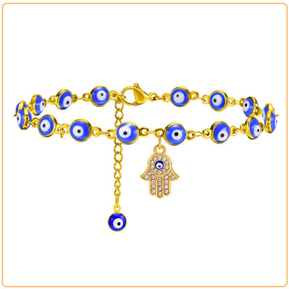 Bracelet de cheville en perles de nazar boncuk bleu avec amulette khamsa sur fond blanc Kaosix