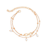 Bracelet de cheville infini et perles chainette dorée sur fond blanc Kaosix