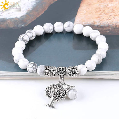 Bracelet en Howlite Blanche Arbre de Vie sur un magazine kaosix