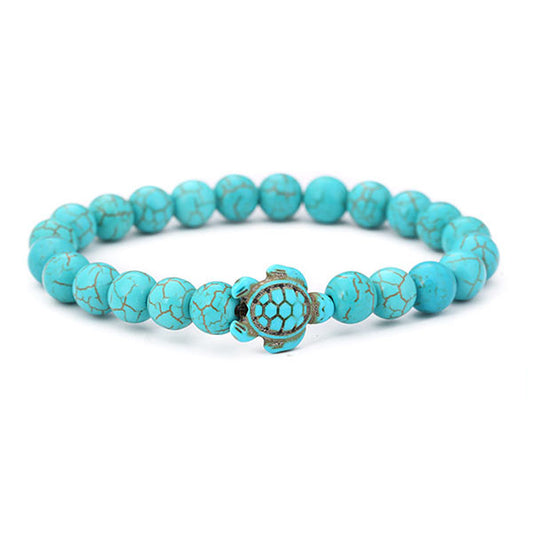 Bracelet pierre bleu turquoise tortue marine sur fond blanc Kaosix