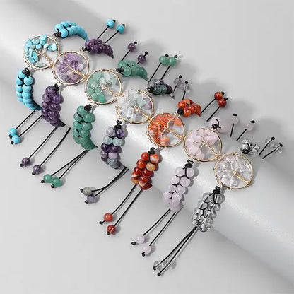 Bracelets Arbre de Vie en Pierres Fines Énergie six pierres sur un socle cylindrique fond gris kaosix