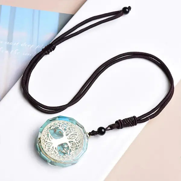 Pendentif Orgonite Arbre de Vie Turquoise à plat deroulé kaosix