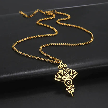 Pendentif Unalome Lotus Or posé sur un socle en cuir noir Kaosix