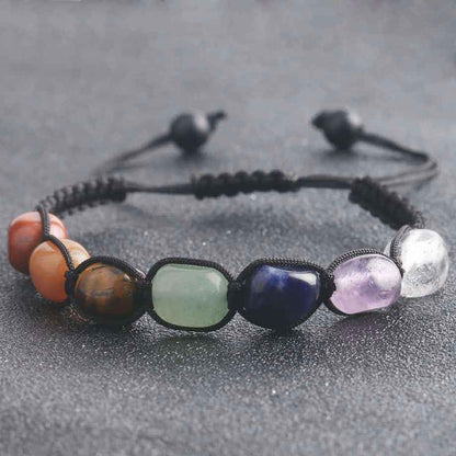 Bracelet 7 chakras harmonie et équilibre sur fond gris Kaosix