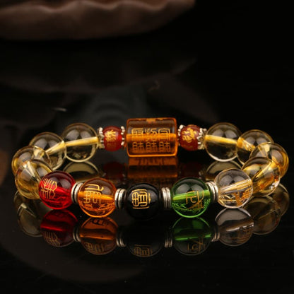 Bracelet Feng Shui Citrine Cinq Dieux et Cinq Éléments sur une table en verre noir et fond noir Kaosix