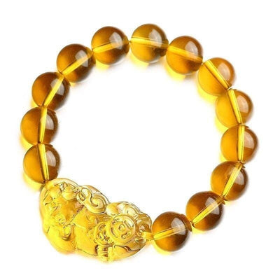 Bracelet Pi Xiu en citrine sur un sol blanc et vue de dessus Kaosix