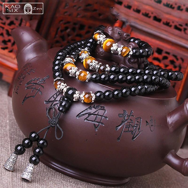 bracelet mala 108 perles onyx noir œil de tigre enroulé sur une théière marron