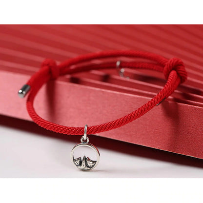 Bracelet couple cordon rouge sur fond rouge Kaosix
