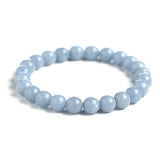 Bracelet en angélite apaisement boule 8 mm sur fond blanc avec cadre orange Kaosix