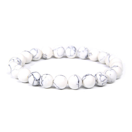 Bracelet en howlite calme boule 8 mm sur fond blanc avec cadre orange Kaosix