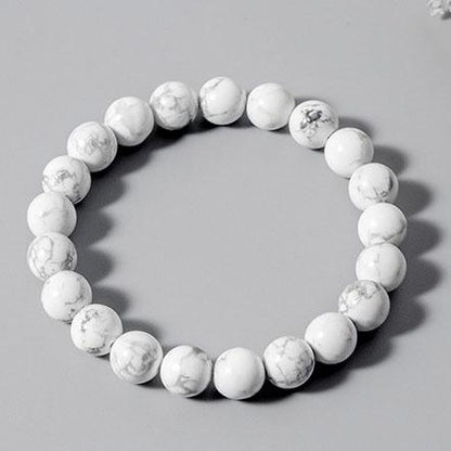 Bracelet en howlite calme boule 8 mm sur fond gris Kaosix