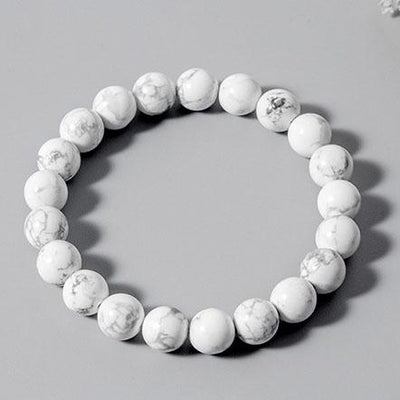 Bracelet en howlite calme boule 8 mm sur fond gris Kaosix