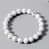Bracelet en howlite calme boule 8 mm sur fond gris Kaosix
