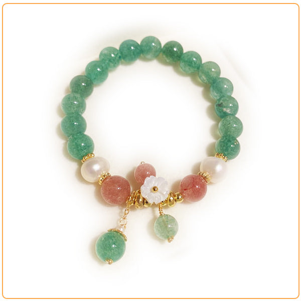 Bracelet en quartz fraise, quartz vert et quartz blanc sur fond blanc avec cadre orange Kaosix