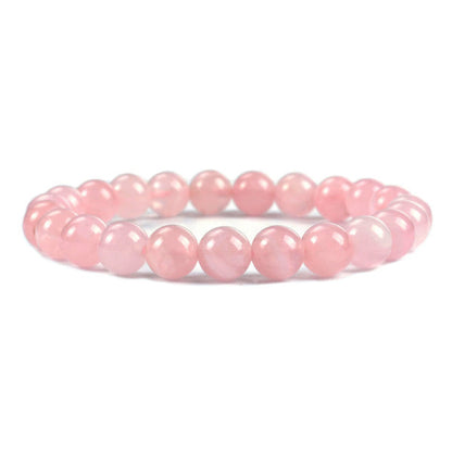 Bracelet en quartz rose amour boule 8mm sur fond blanc avec cadre orange Kaosix