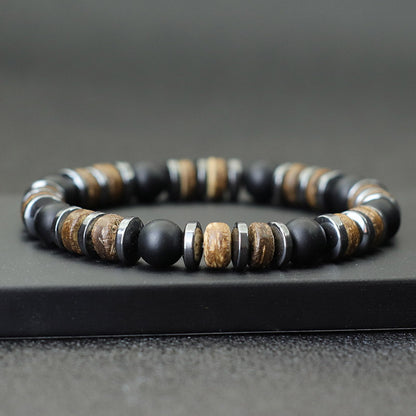 Bracelet homme onyx noir hématite bois de cocotier sur un socle noir Kaosix