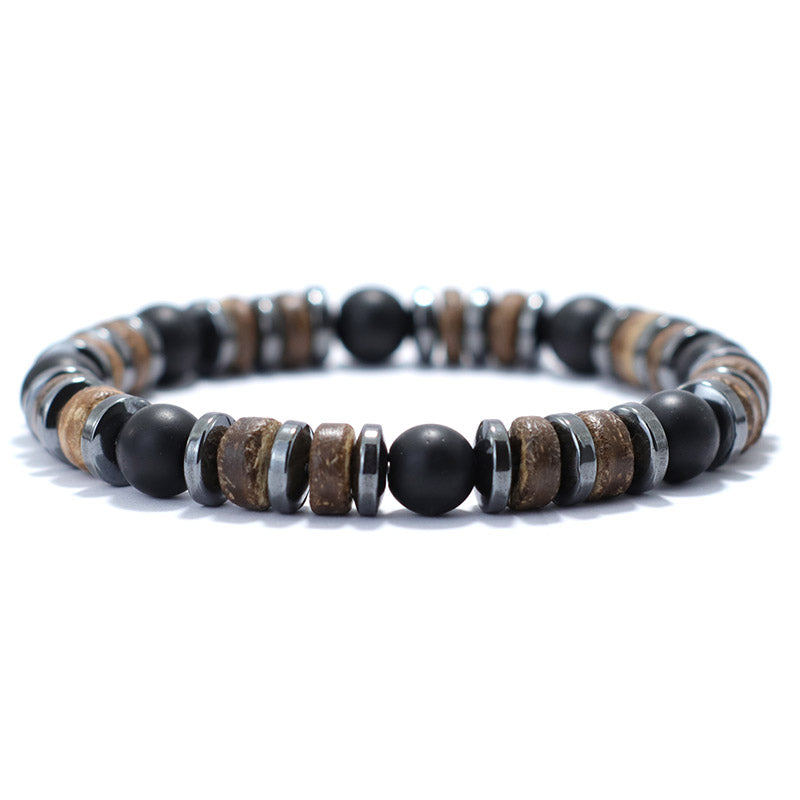 Bracelet homme onyx noir hématite bois de cocotier sur un sol blanc Kaosix