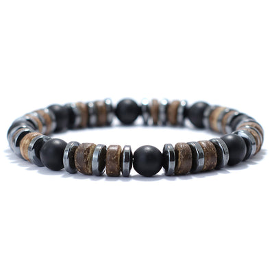 Bracelet homme onyx noir hématite bois de cocotier sur un sol blanc Kaosix