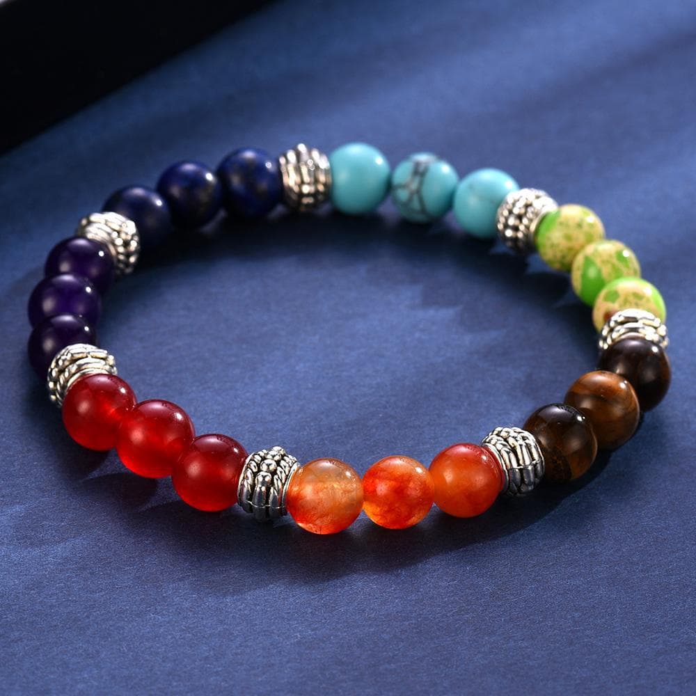 Véritable bracelet 7 chakras sur tapis bleu kaosix