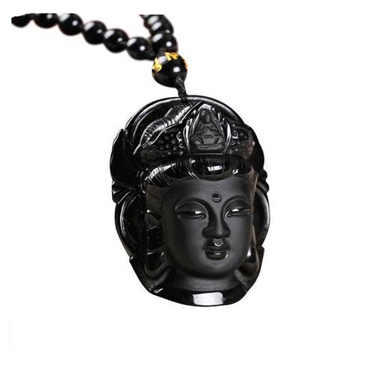 Pendentif tête de Bouddha obsidienne noire sur fond blanc avec cadre orange kaosix