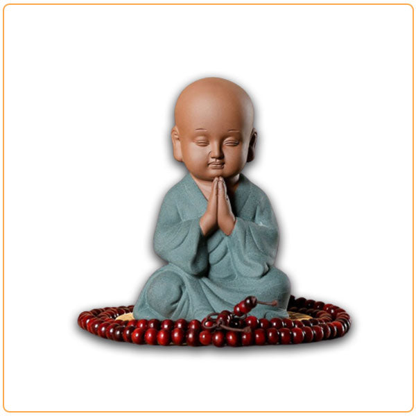 Petite statue moine bouddhiste salutation