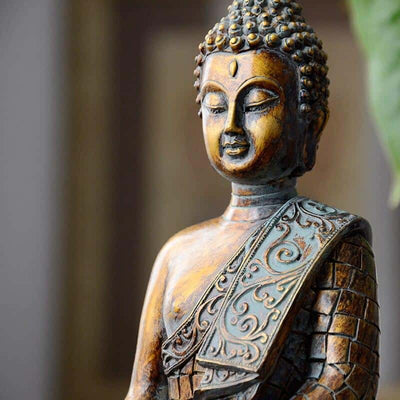 Petite statuette bouddha assis Thaïlande posture de lappel de la terre vue de près kaosix