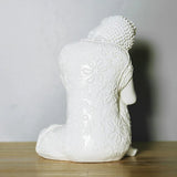 Vue de dos de statue Bouddha assis penseur blanc sur table en bois et fond gris Kaosix