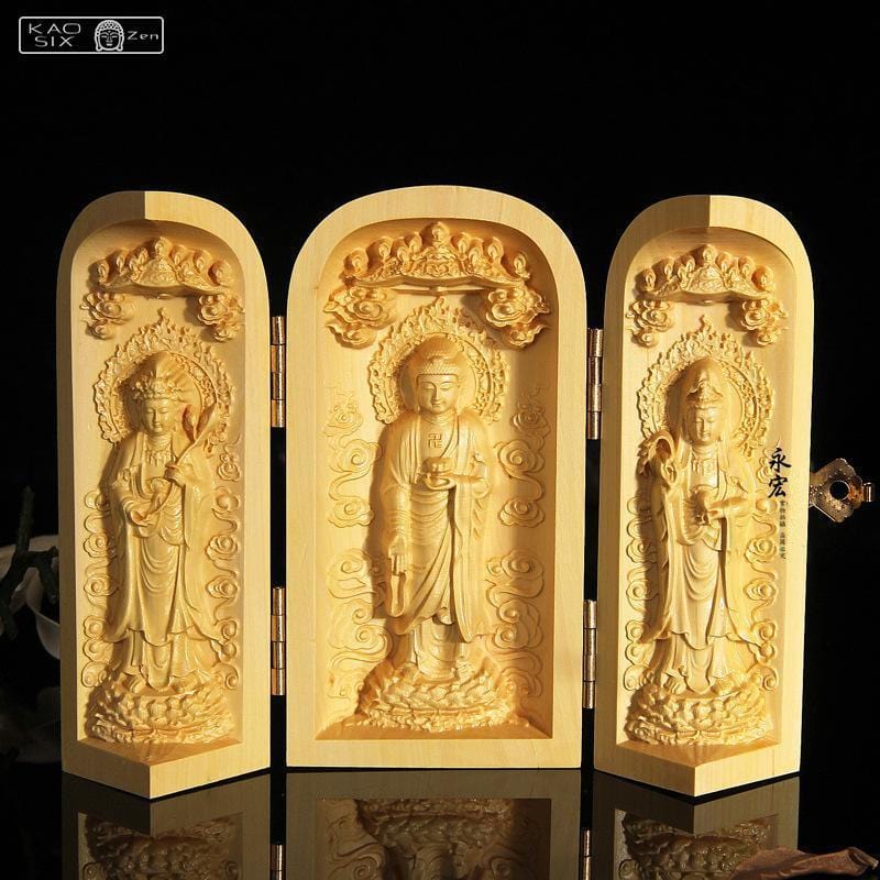 Trois statues Bouddha coffret cylindrique en bois sur fond noir 