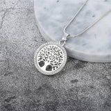 Pendentif arbre de vie métal argenté cadre rond sur socle kaosix